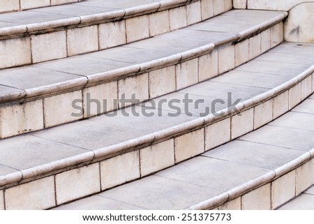 fragment of the old stairs of marble tiles with cracks and scratches, background