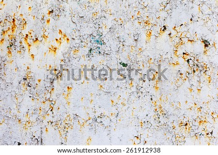 Abstract rusty metal surface with cracked white paint. Textured background for your concept or project. Great background or texture.