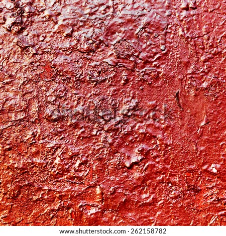 Creative background beautiful concrete carelessly painted with red paint streaks and specks, cracks and scratches. Grungy concrete surface. Great background or texture for your project.