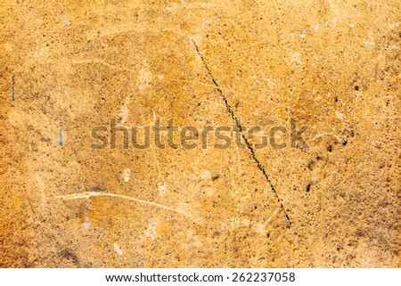 Creative background beautiful concrete carelessly painted with red paint streaks and specks, cracks and scratches. Grungy concrete surface. Great background or texture for your project.