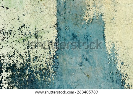 Abstract background concrete painted yellow and green paint, weathered with cracks and scratches. Landscape style. Grungy Concrete Surface. Great background or texture.
