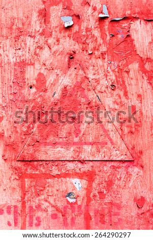 Creative background metal triangle cracks and scratches carelessly painted with red paint. Textured background for your concept or project. Great background or texture.
