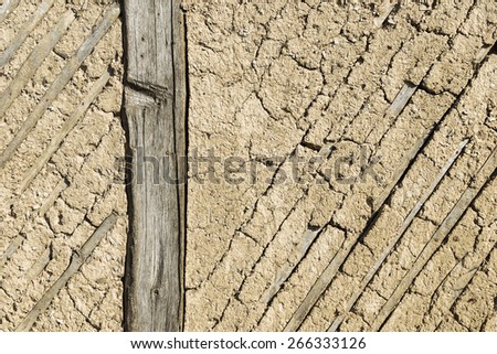Texture of the old adobe walls, old plaster, retro construction technology of the 18th century country house