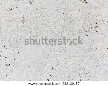 Creative background of rusty metal with cracks and scratches, casually painted white. Grungy metal surface. Great background or texture for your project.