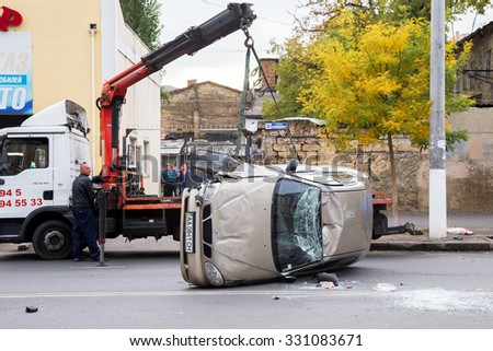 ODESSA, UKRAINE - OCTOBER 24, 2015: car hauler picks up after a car accident October 24, 2015 in Odessa, Ukraine