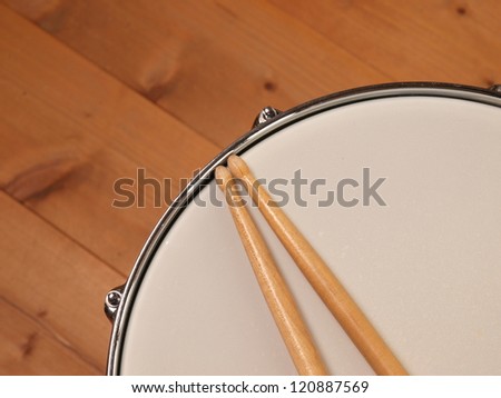 Detail of a snare drum with drum sticks