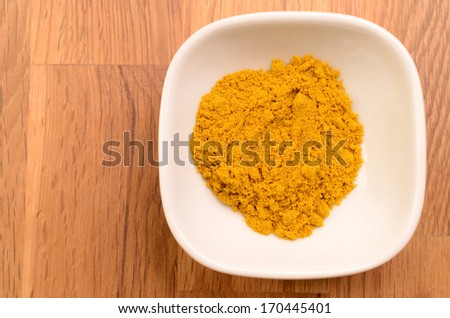 Curry powder in a white ceramic bowl
