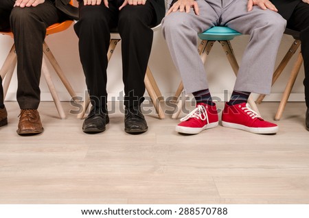 Four business men waiting for an interview