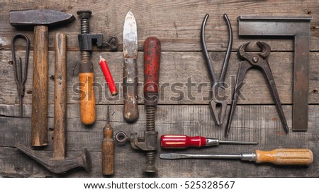 Old wood worker tools on a used wooden table