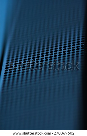 Hi-tech abstract background. The perforated metal texture.