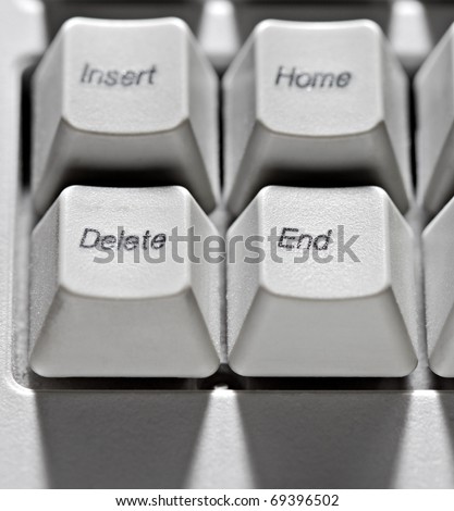 Old type computer keys delete, end in contrast light.