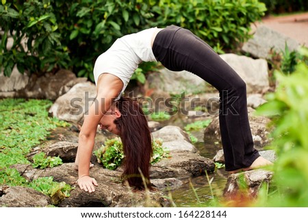 Spiritual fit woman doing yoga pose \