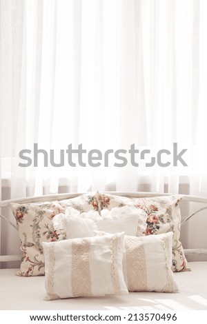 Cozy light pillow on bed