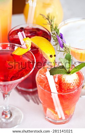 Summer cocktails with pieces of fruit on white background