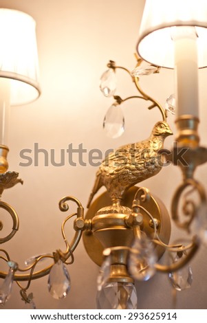 Chrystal chandelier close-up. Glamour lamp with crystal and gold metal