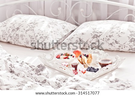 Breakfast in Bed. Cottage Cheese, coffee, berries, cookies and jam. Sweet morning.