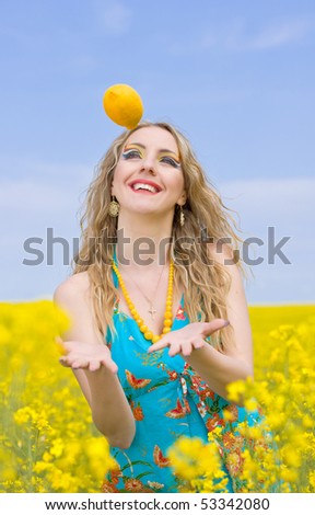 beautiful woman with lemon outside