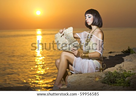 Cleopatra reads the papyrus near the sea