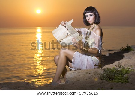Cleopatra reads the papyrus near the sea