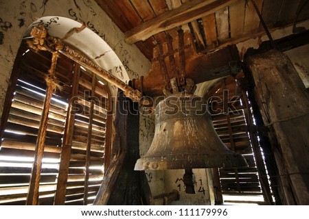 an old bell in a church tower