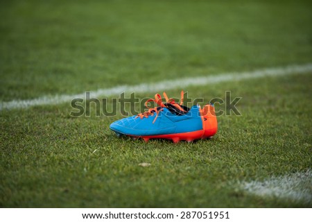 Football boots on grass field