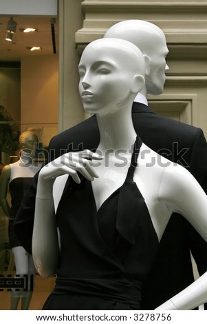 Pair dummies in a show-window of shop of fashionable clothes