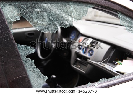 Night crime - the broken window of the car and abduction of things from a box on the forward panel