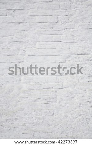 The brick wall painted with a white paint