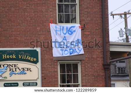 NEWTOWN, CT., USA-DEC 16: Sandy Hook Elementary School shooting, Hug a Teacher hanging sign, Dec 16, 2012 in Newtown, CT., USA