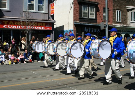 TORONTO - APRIL 12: Marching drum band parade on Toronto street at Easter parade April 12, 2009 in Toronto, Canada. More than 25,000 people attended the parade.