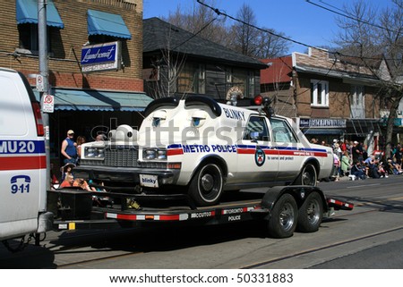 TORONTO, CANADA - APRIL 4: Retro police  cars take part in an annual Easter Parade 2010 April 4, 2010 in Toronto, Canada.