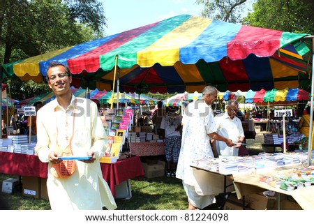 TORONTO – JULY 17:  Book sellers at 39th Annual festival of India in July 17 2011 on Central Island in Toronto, Canada. The festival is a popular annual tourist attraction  for the last 39 years.