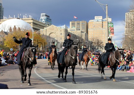 TORONTO, CANADA – NOVEMBER 20: Royal Mounted police at Christmas Parade  November 20, 2011 in Toronto Downtown, Canada
