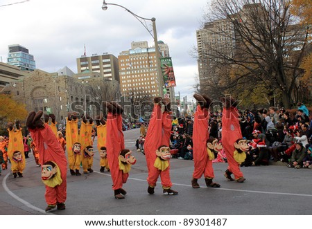 TORONTO, CANADA – NOVEMBER 20: Participants in monkey costumes take part in Christmas Parade  November 20, 2011 in Toronto Downtown, Canada
