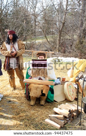 RICHMOND HILL – FEBRUARY 05: The Indians in costumes  at Winter Carnival in Mill Pond Park in Richmond Hill, Canada in February 05, 2012.