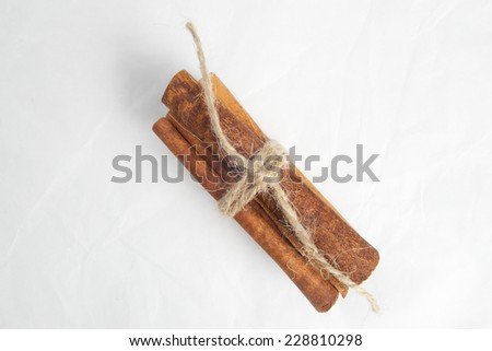 Sweet brown cinnamon spice sticks on white background