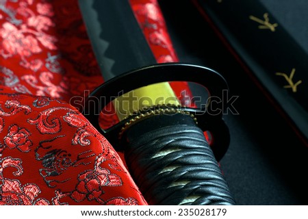 Japanese sword katana on satin background