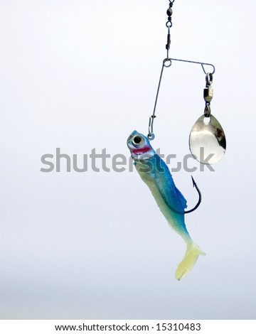 A fishing lure hanging from a fishing line.