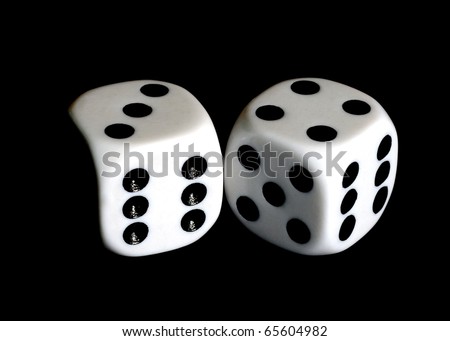 Close up of a pair of dice with seven and eleven showing.
