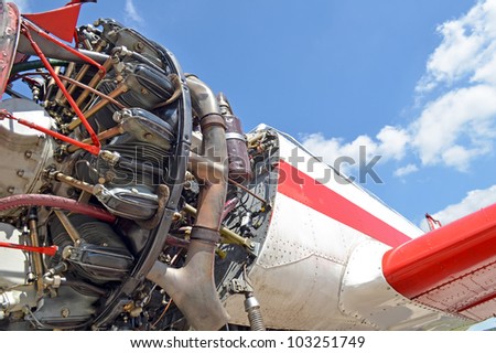 Old aircraft against blue sky, aircraft engine close up