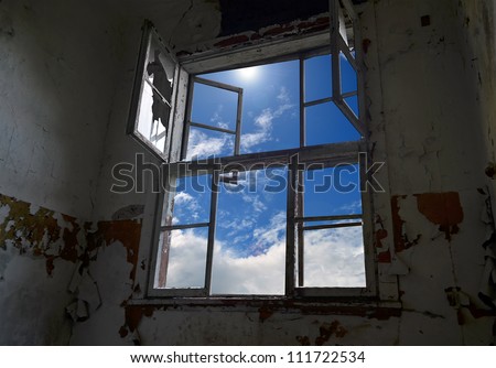 Abandoned room interior with broken window
