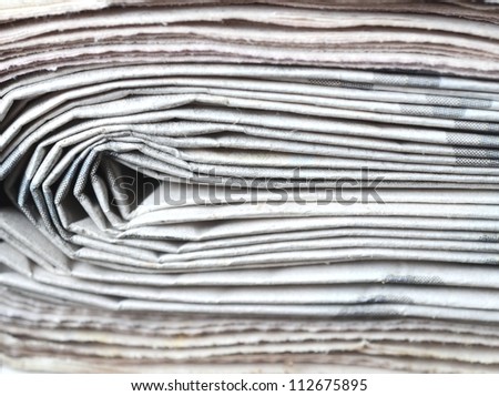 Newspapers, stack of newspapers close up