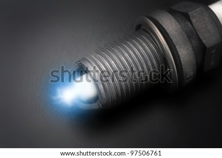 Spark plug on black background close up