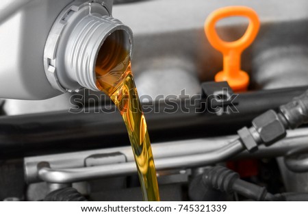 New motor oil, car engine close-up