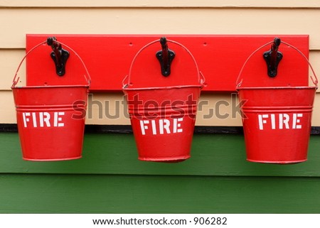fire buckets hanging on a wall