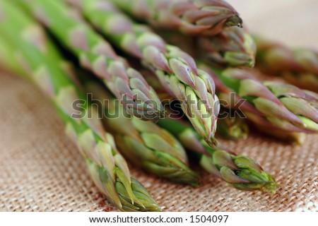 green vegetable, asparagus tips placed on hessian table mat