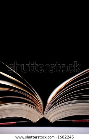 open book, dim lighting for effect