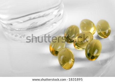 vitamins and minerals with a glass of water