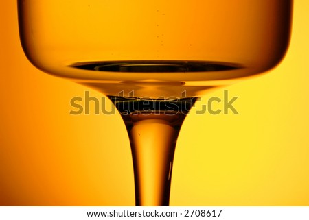 glass of white wine with ambient golden light,smooth warm tones