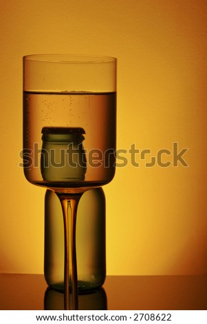 bottle and glass of alcohol with golden ambient light